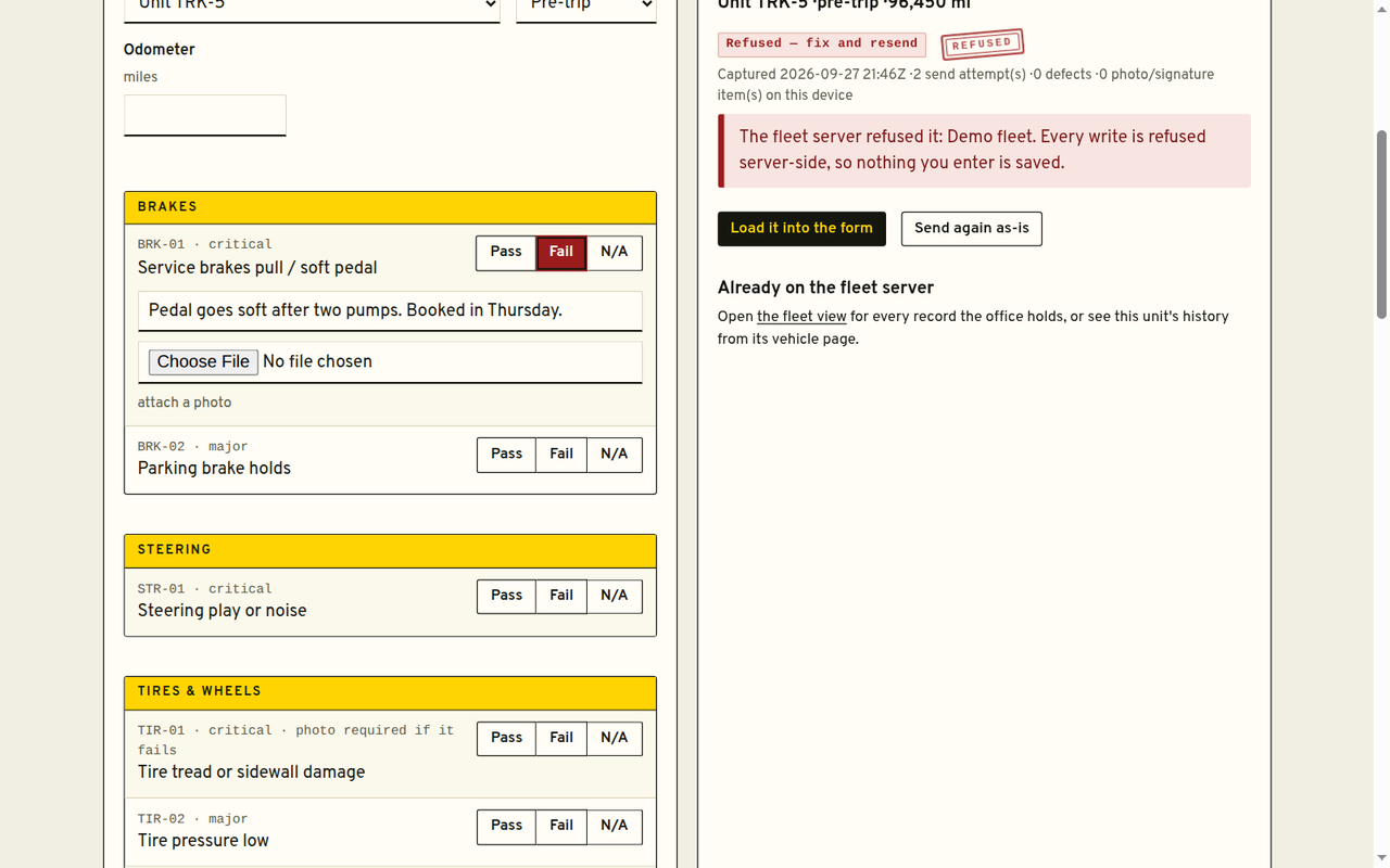 Driver app pre-trip checklist with pass, fail and N/A answers, photo attach, and the device status line